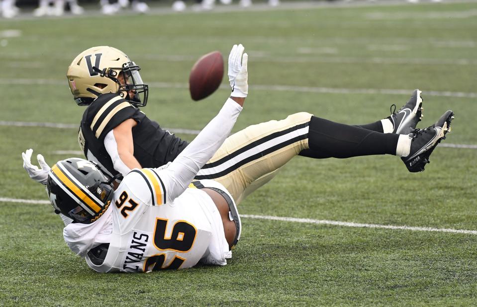 Vanderbilt wide receiver Cam Johnson (7) is unable to catch a pass as he is defended by Missouri defensive back Akayleb Evans (26) during the first half Oct. 30, 2021, at Vanderbilt Stadium in Nashville, Tenn.