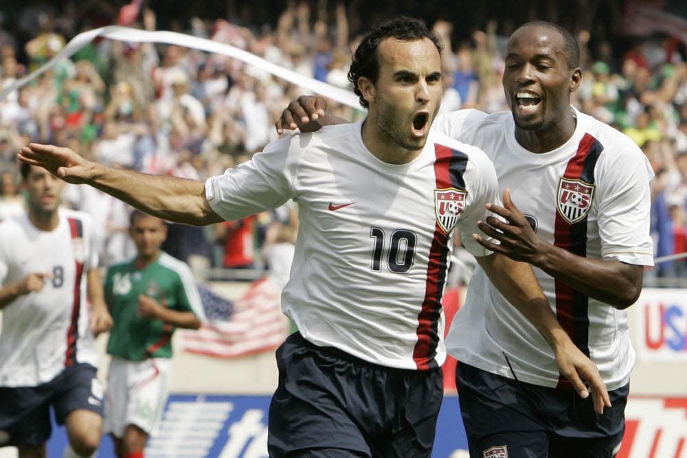 USA’s Landon Donovan, left, celebrates with DaMarcus Beasley after scoring a penalty kick against Mexico during the second half of the Gold Cup Soccer game, Sunday, June 24, 2007, in Chicago. (AP Photo/Nam Y. Huh, File)