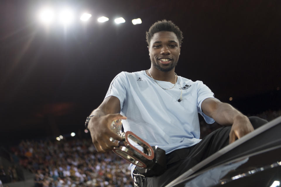 Noah Lyles from the USA poses with the Diamond League trophy at the award ceremony after winning the men's 100m race, during the Weltklasse IAAF Diamond League international athletics meeting in the stadium Letzigrund in Zurich, Switzerland, Thursday, August 29, 2019. (Jean-Christophe Bott/Keystone via AP)