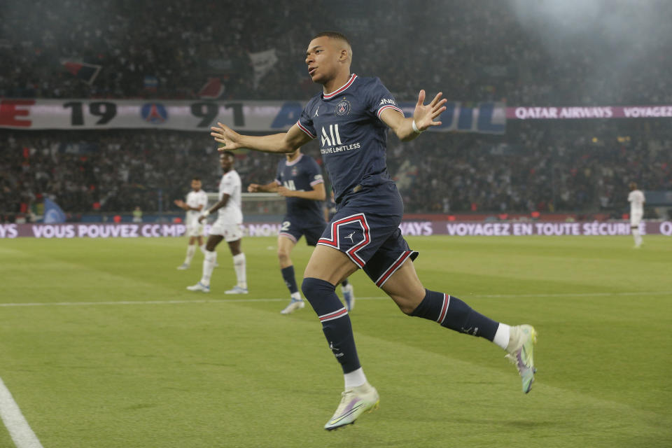 PSG's Kylian Mbappe reacts after scoring a goal during the French League One soccer match between Paris Saint Germain and Metz at the Parc des Princes stadium in Paris, France, Saturday, May 21, 2022. (AP Photo/Michel Spingler)