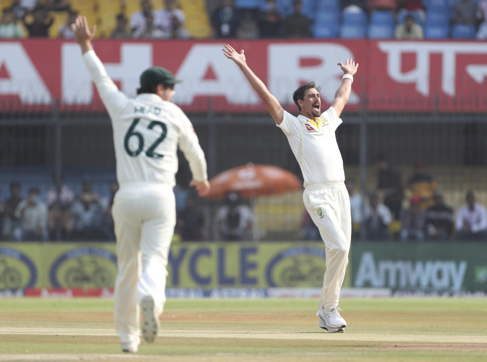 Australia's Mitchell Starc, right, appeals unsuccessfully for LBW against India's captain Rohit Sharma during the first day of third cricket test match between India and Australia in Indore, India, Wednesday, March 1, 2023. (AP Photo/Surjeet Yadav)