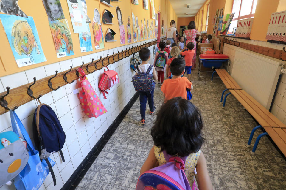 Illustration picture shows kids and their schoolbags in the hall outside their classroom, in a kindergarden school in Etterbeek, Brussels, Tuesday 02 June 2020. Schools for children under six years old are reopening today for everyone. Belgium is in its twelfth week of confinement in the ongoing corona virus crisis and the third week of the phase 2 of the deconfinement. BELGA PHOTO THIERRY ROGE (Photo by THIERRY ROGE/BELGA MAG/AFP via Getty Images)