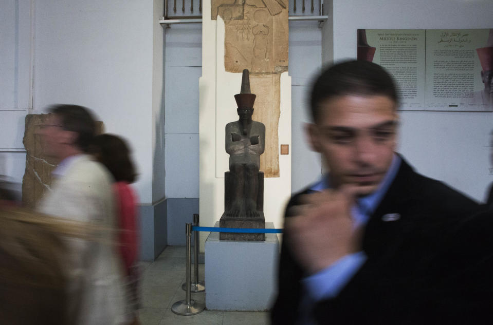 Guests participate in a tour at the Egyptian Museum after its renovation project announcement in downtown Cairo, Egypt, Friday, Nov. 15, 2013. Egypt unveiled Friday an ambitious renovation project for its Cairo’s famed Egyptian Museum, in a bid to show that the Arab world’s most populous country was regaining a sense of normalcy after months of unrest. (AP Photo/Hiro Komae)