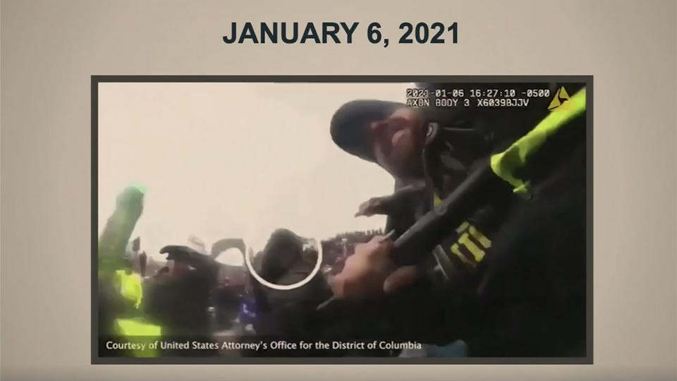 Footage from an officer's body camera taken during the Jan. 6 attack on the Capitol is shown during former President Donald Trump's impeachment trial Wednesday. (Screengrab via Reuters TV)