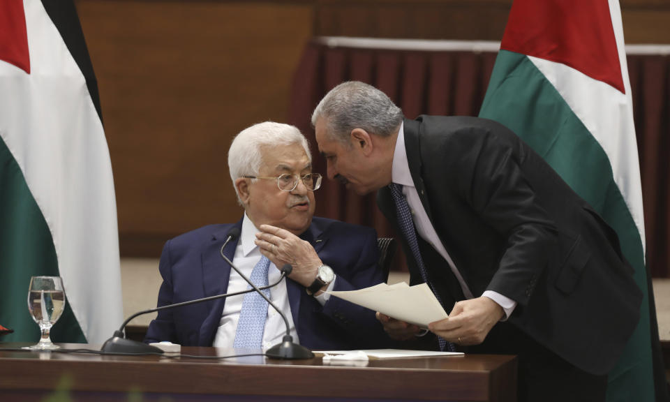 Palestinian President Mahmoud Abbas, left, heads a leadership meeting at his headquarters, in the West Bank city of Ramallah, Tuesday, May 19, 2020. (Alaa Badarneh/Pool Photo via AP)