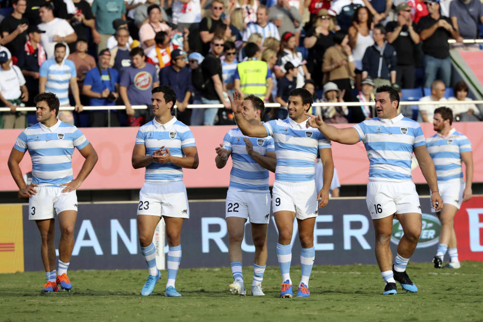 Argentina's players greet spectators after the Rugby World Cup Pool C game at Kumagaya Rugby Stadium between US and Argentina in Kumagaya, Japan, Saturday, Oct. 9, 2019. (AP Photo/Eugene Hoshiko)