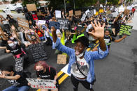 Tiffany Swaby of Lithonia shouts while protesting in front of city hall Friday, June 5, 2020, in Atlanta. Protests are being held throughout the country over the death of Floyd, a black man who died after being restrained by Minneapolis police officers on May 25. (John Amis/Atlanta Journal-Constitution via AP)