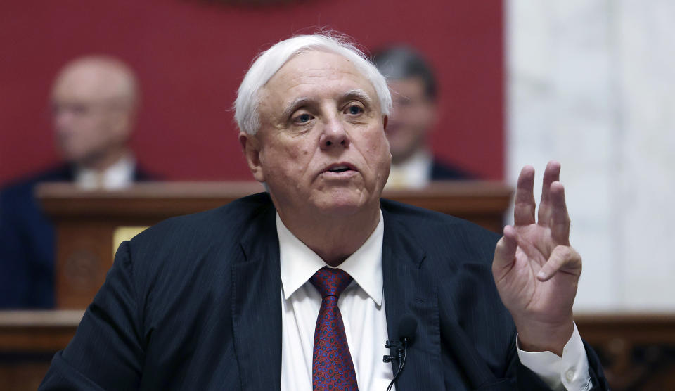 FILE - West Virginia Gov. Jim Justice delivers his annual State of the State address in the House Chambers at the state capitol in Charleston, W.Va., on Jan. 11, 2023. Justice signed a bill Wednesday, March 1, 2023, allowing people with concealed carry permits to bring firearms on public college and university campuses in the state. (AP Photo/Chris Jackson, file)