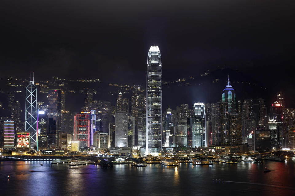 In this Tuesday, Jan. 24, 2012 photo, a night view of the Hong Kong Island's legendary skyline is seen. With its bustling harbor and glittering, neon-drenched skyscrapers set against a backdrop of verdant, towering peaks, Hong Kong is undeniably one of the world's most scenic cities. (AP Photo/Vincent Yu)