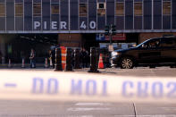 <p>Police gather at the scene after reports of multiple people injured after a truck plowed through a bike path in lower Manhattan on Oct. 31, 2017 in New York City. (Photo: Andy Kiss/Getty Images) </p>