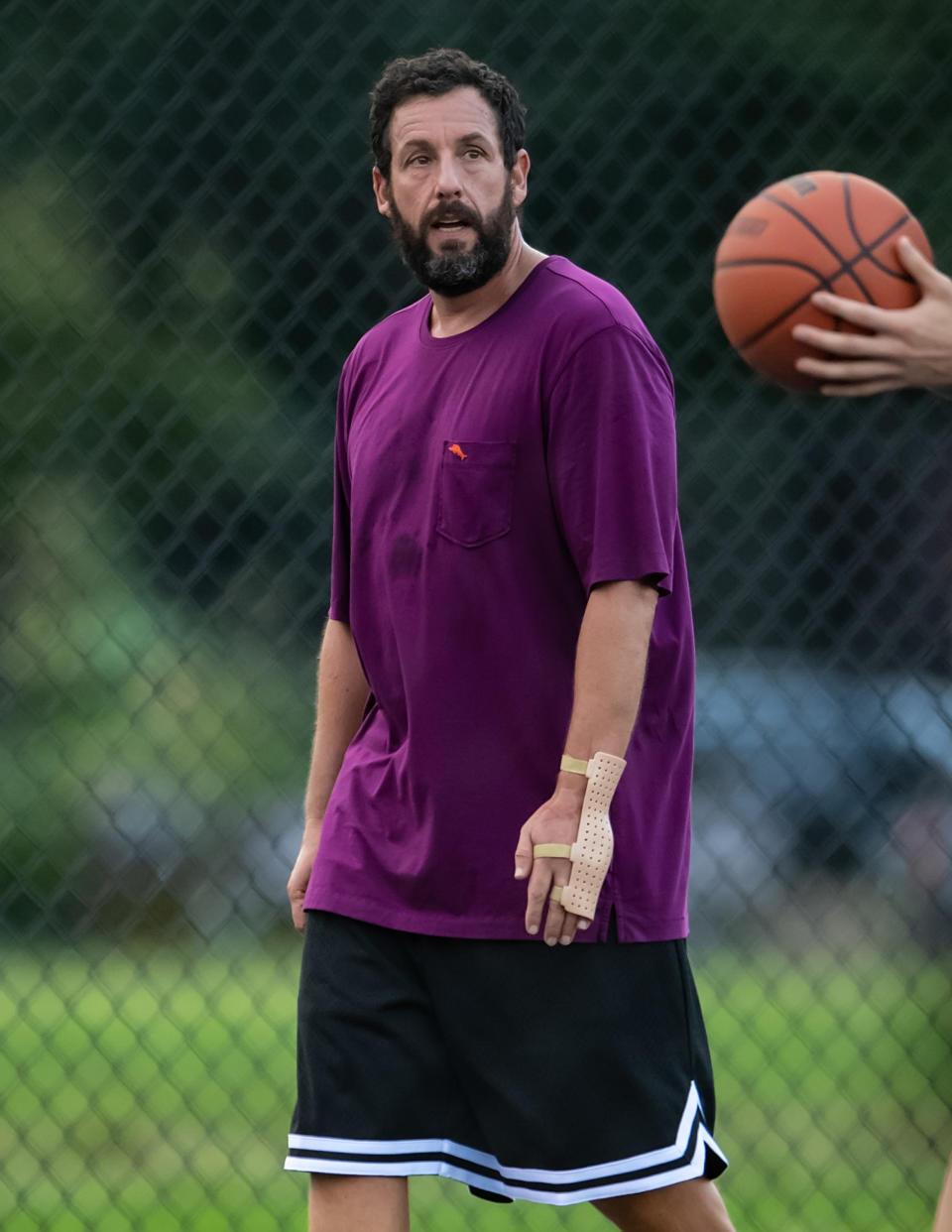 Adam Sandler playing basketball