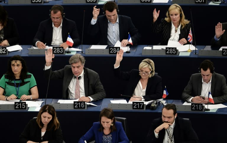 Far-right presidential candidate Marine Le Pen, pictured at the European parliament in Strasbourg (2nd row 2nd R), has dismissed the inquiry as a "political" attempt to derail her presidential bid
