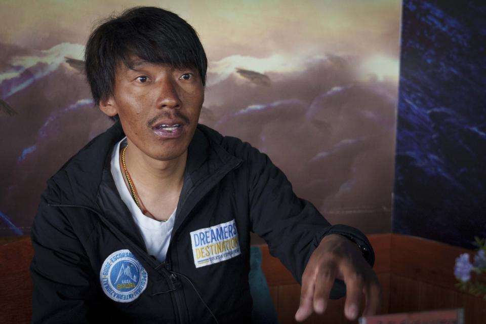 Phurba Tenjing, a Sherpa guide who just scaled Mount Everest, for the 16th time speaks to the Associated Press in Kathmandu, Nepal, Thursday, May 25, 2023. Tenjing has been climbing Everest since the age of 17 and said both the snow and ice have melted and the trek that sued to take five or six hours over the icy path now only takes half hour because the glaciers have melted and bare rocks are exposed. Nepal is getting ready to mark the 70th anniversary of the conquest of the peak. (AP Photo/Niranjan Shrestha)