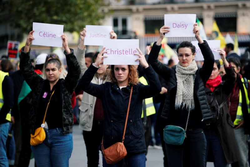 People attend a demonstration against femicide and violence against women at Place de la Republique in Paris