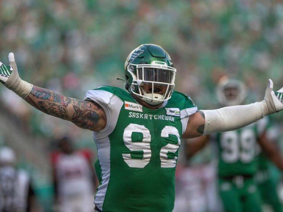 Defensive lineman Garrett Marino (92), seen here playing for the Roughriders in 2021, was released by Saskatchewan on Tuesday following a controversial hit on Winnipeg Blue Bombers quarterback Zach Collaros. (Kayle Neis/The Canadian Press - image credit)