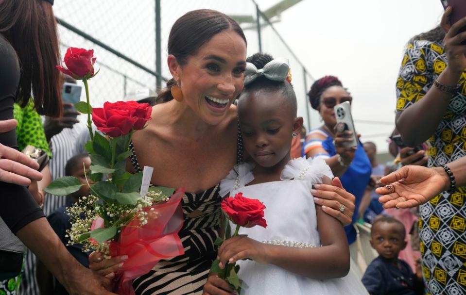 Meghan Markle with a young Nigerian girl on May 11, 2024. AP