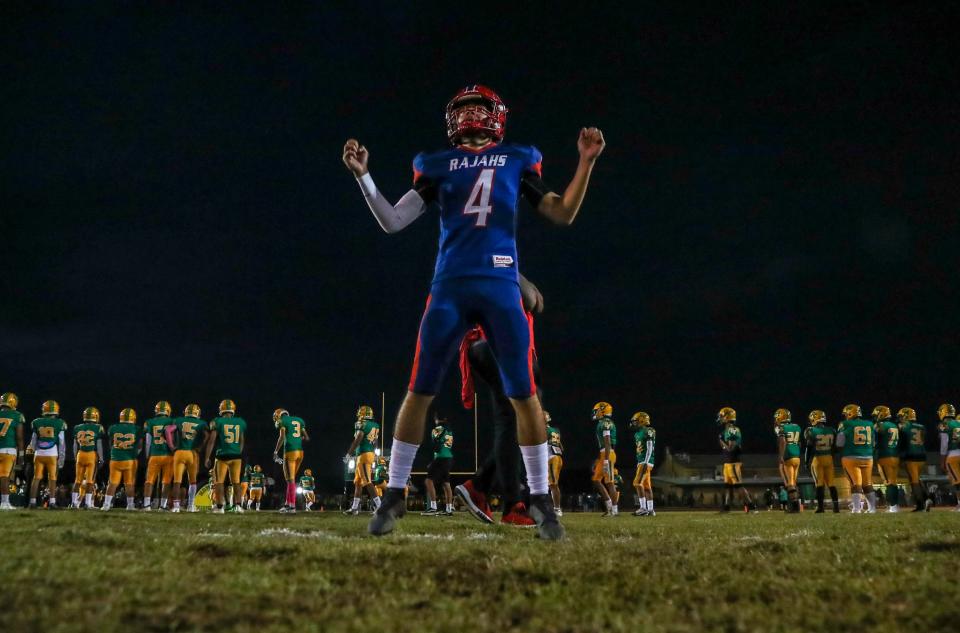 Indio's Fabian Garcia (4) leads his team in jumping jacks before their game at Coachella Valley High School in Thermal, Calif., Friday, Oct. 28, 2022. 