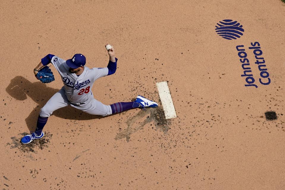 Los Angeles Dodgers starting pitcher Andrew Heaney throws during the first inning of a baseball game against the Milwaukee Brewers Thursday, Aug. 18, 2022, in Milwaukee. (AP Photo/Morry Gash)