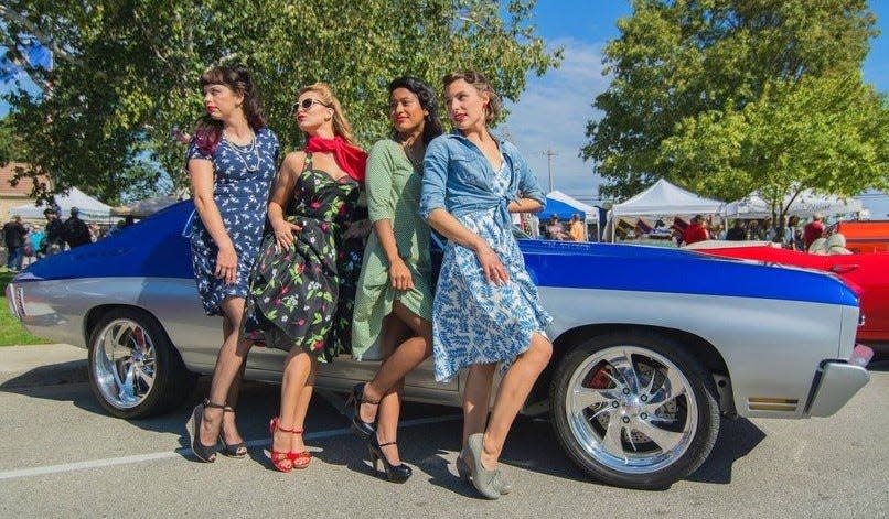 Models pose with a classic, show-quality Chevy Chevelle during last year's Pin Ups & Pistons classic car show and photo shoot at Baileys Harbor Autumnfest. The annual fall festival and car show returns this year on Sept. 23.