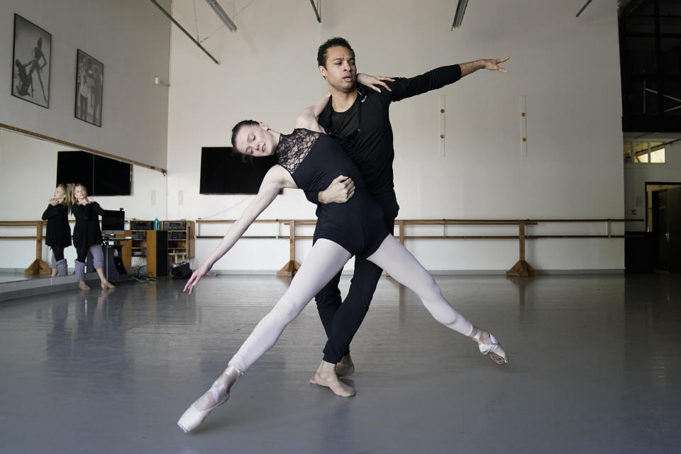 Adrian Blake Mitchell, right, and Andrea Laššáková rehearse with Francine Kessler Lavac, left, on Monday, April 18, 2022, in Santa Monica, Calif. Mitchell and Laššáková left their positions at the Mikhailovsky Ballet Theatre in St. Petersburg and fled Russia ahead of the invasion of Ukraine. (AP Photo/Ashley Landis)