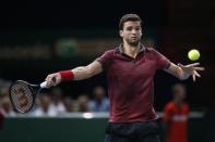 Grigor Dimitrov of Bulgaria returns a shot during his men's singles tennis match against Andy Murray of Britain in the third round of the Paris Masters tennis tournament at the Bercy sports hall in Paris, October 30, 2014. REUTERS/Benoit Tessier