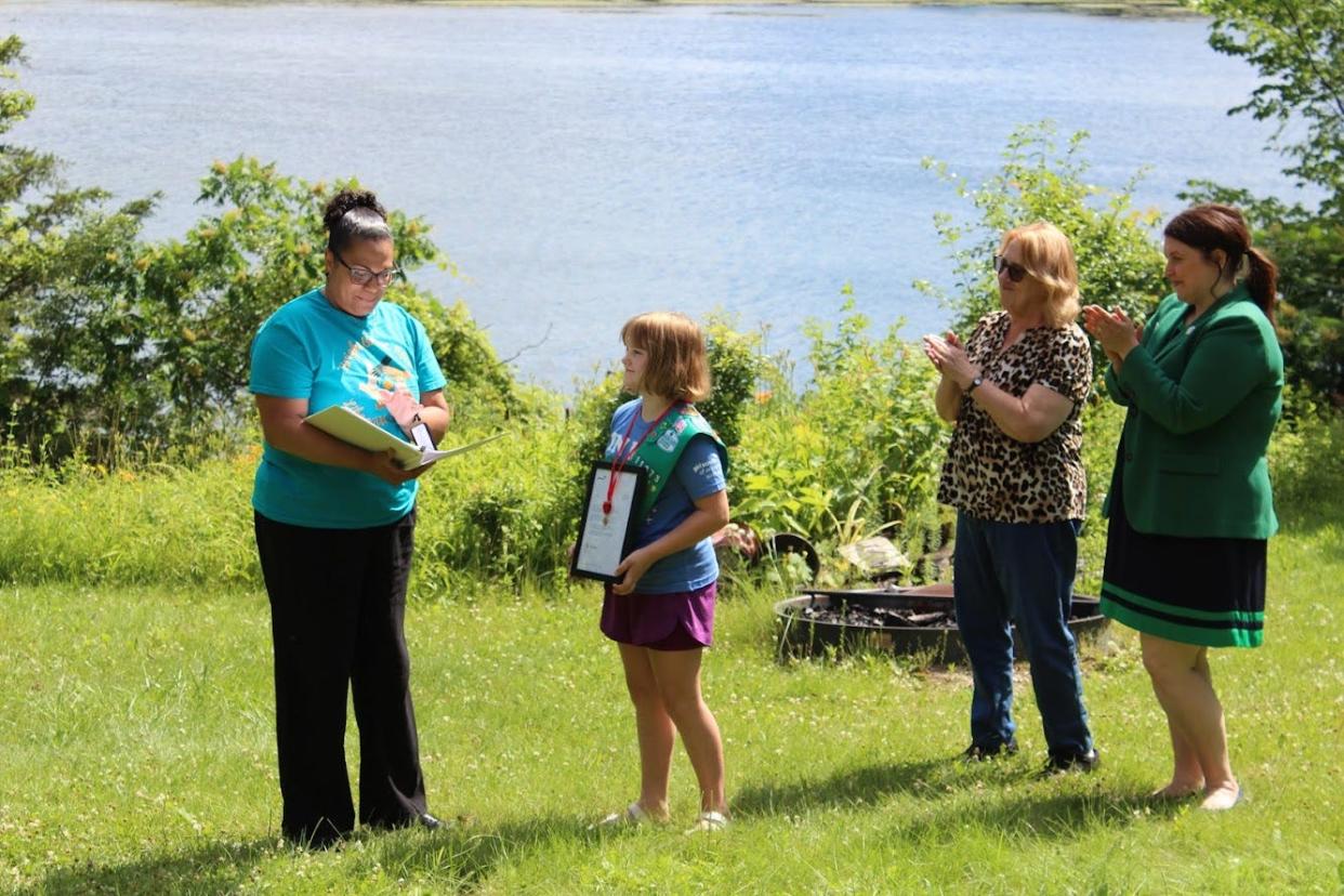 Aspyn Osse of Cudahy received the Girl Scouts National Lifesaving Medal of Honor June 26 after she saved her grandmother's life. Pictured (from left) are Ana Simpson, CEO of Girl Scouts of Wisconsin Southeast, Osse, Aspyn's grandmother Harriet Miller, and Ashley Hatley-Caruso, COO of Girl Scouts of Wisconsin Southeast.