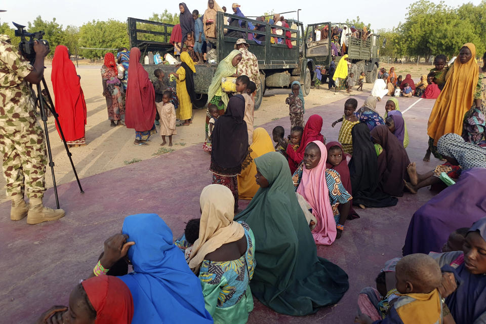 Women and children who were held captive by islamic extremists, and rescued by Nigeria's army, are seen upon arrival in Maiduguri, Nigeria, Monday, May 20, 2024. Hundreds of hostages mostly children whose mothers were held captive and forcefully married by Islamic extremists in northeastern Nigeria have been rescued from their key forest enclave and handed over to authorities, the West African nation's army said late Monday. (AP Photo/Jossy Olatunji)