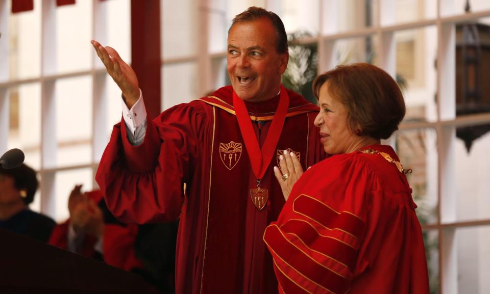 Rick Caruso, left, with Dr. Carol L. Folt during her 2019 inauguration as USC's president.