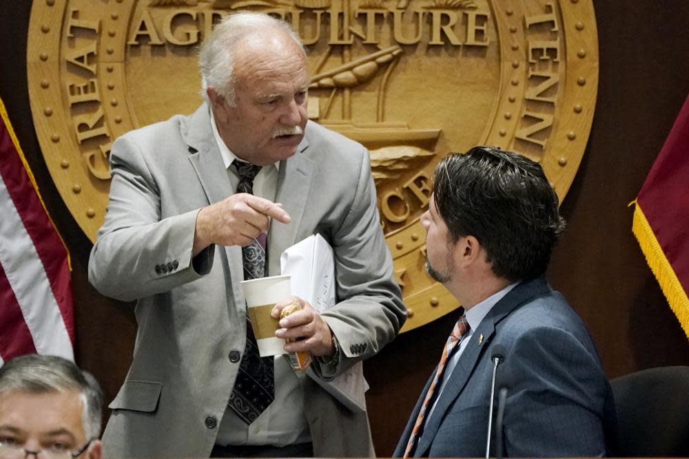 Rep. Bud Hulsey, R-Kingsport, left, talks with Rep. Andrew Farmer, R-Sevierville, before a meeting of the COVID-19 Committee, Oct. 28, 2021, in Nashville, Tenn. (AP Photo/Mark Humphrey, FILE)