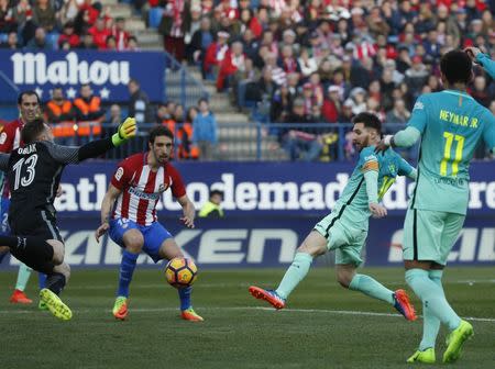 Football Soccer - Atletico Madrid v Barcelona - Spanish La Liga Santander - Vicente Calderon Stadium, Madrid, Spain, 26/02/17 Barcelona's Lionel Messi scores a goal past Atletico Madrid's goalkeeper Jan Oblak. REUTERS/Susana Vera