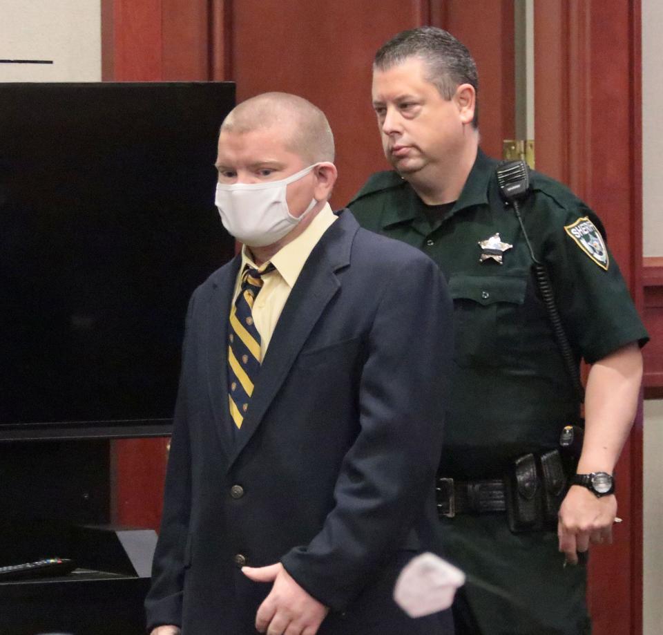 Defendant Robert Kern enters the courtroom, escorted by a Volusia County Sheriff's Office bailiff, as he goes on trial for the 2018 killing of 16-year-old Justis Marie Garrett, Wednesday, Aug. 3, 2022, in the Volusia County Courthouse in DeLand.