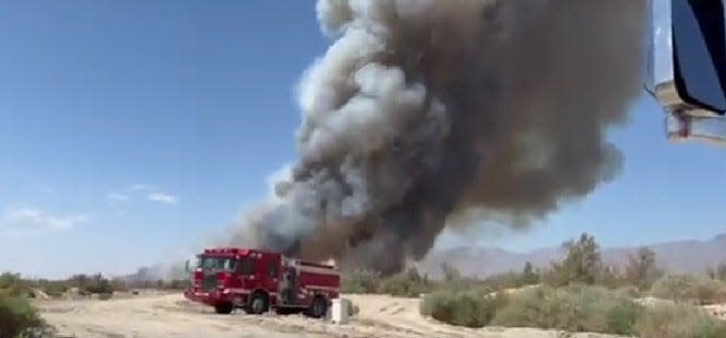 A fire burning off Highway 111 near Mecca on June 21, 2022.