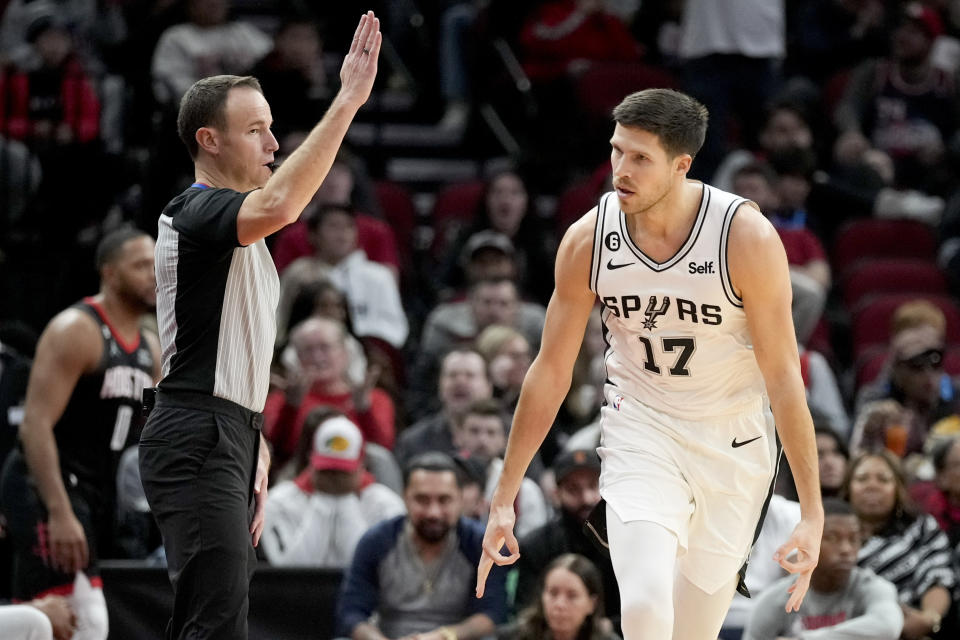 San Antonio Spurs forward Doug McDermott (17) reacts after making a three point basket during the second half of an NBA basketball game against the Houston Rockets, Monday, Dec. 19, 2022, in Houston. (AP Photo/Eric Christian Smith)