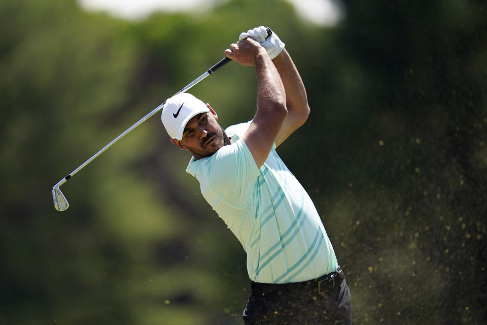 Brooks Koepka hits on the 16th hole during a practice round for the U.S. Open golf tournament at The Country Club, Wednesday, June 15, 2022, in Brookline, Mass. (AP Photo/Julio Cortez)