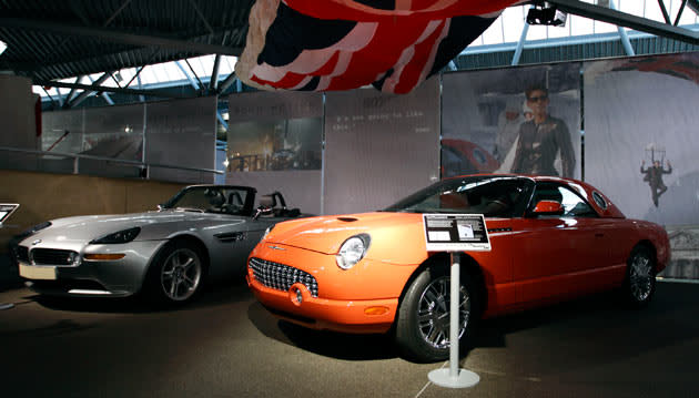 A picture shows the BMW Z8 (L) from the 1999 James Bond film "The World is Not Enough" sitting next to the Ford Thurderbird (R) used in the 2002 Bond film "Die Another Day" on display at the opening of a press preview of the Bond in Motion exhibition at the Beaulieu National Motor Museum at Brockenhurst in the southern English county of Hampshire on January 15, 2012. The Bond in Motion exhbition features fifty original iconic vehicles used in the James Bond films to celebrate fifty years of 007 and will open to the public from January 17. AFP PHOTO/ JUSTIN TALLIS