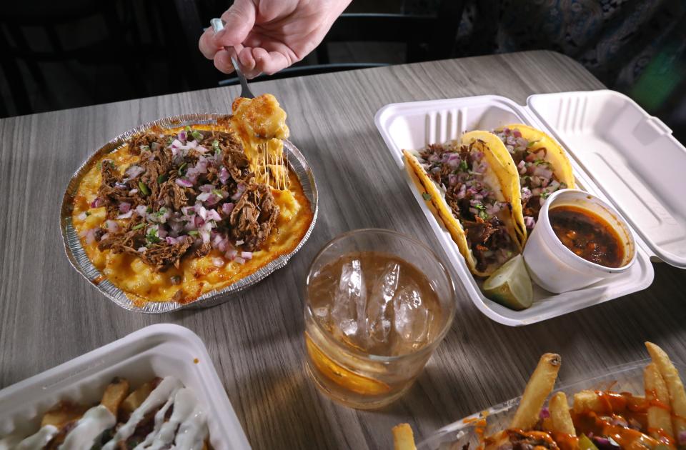 Diving into a cheese goodness of Birria Baked Mac & Cheese at the new TacoDero restaurant.