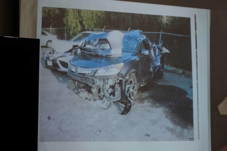 A photo of the car that crashed near the intersection of Sacramento Drive and Basil Lane on Nov. 21, 2022, is shown during the preliminary hearing against Daniel Saligan Patricio on Nov. 14, 2023. Saligan Patricio is charged with two counts of vehicular manslaughter for the deaths of Jennifer Besser and Matthew Chachere on Nov. 21, 2022.