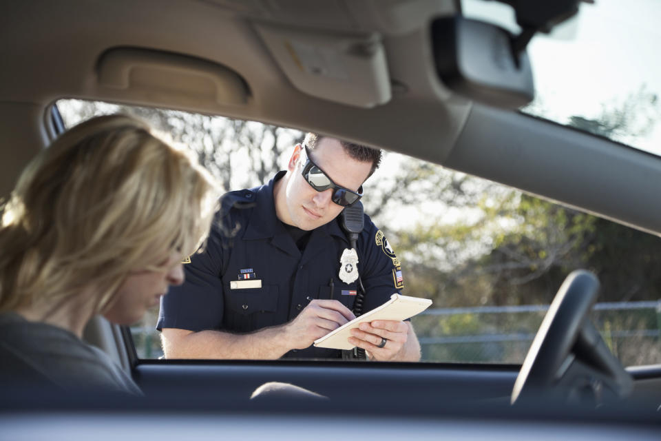 a cop giving someone a ticket