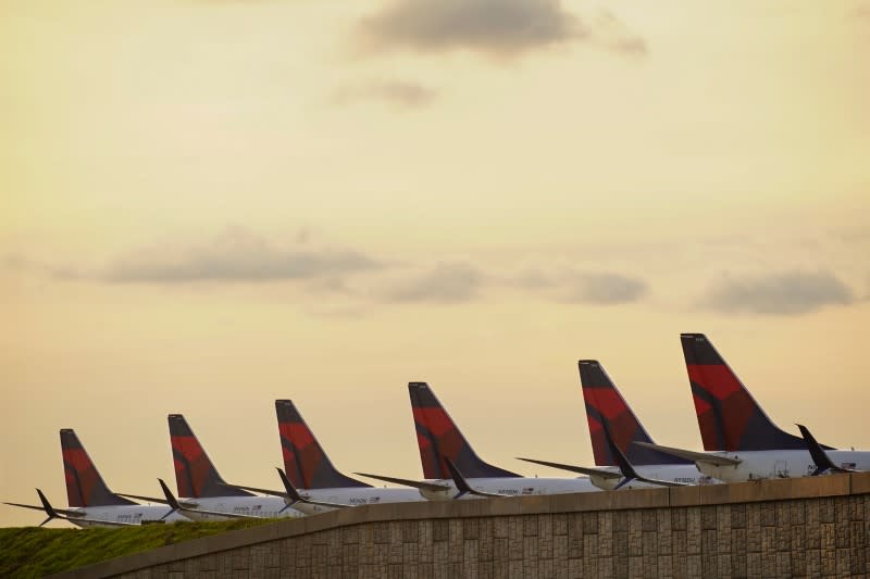 FILE PHOTO: Delta Air Lines passenger planes are seen lined up on a runway in Atlanta