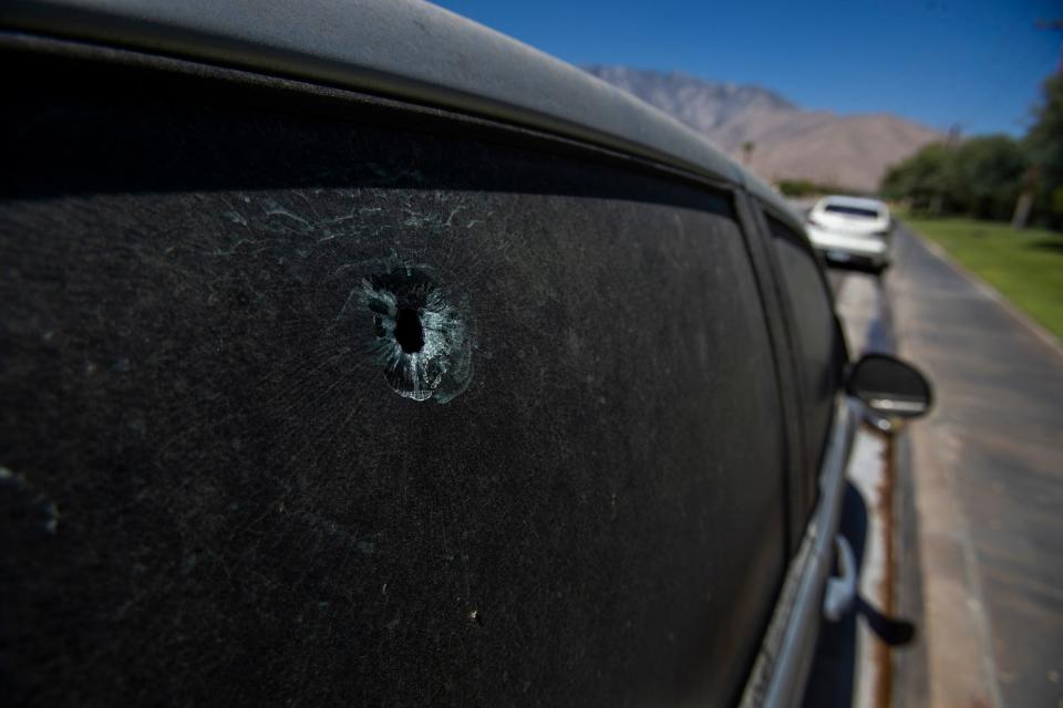 A bullet hole in the window of a vehicle on San Rafael Drive near the entrance of the Santiago Sunrise mobile home park in Palm Springs.