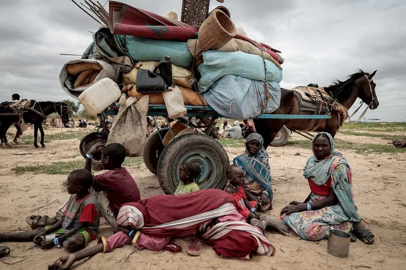 FILE PHOTO: A Sudanese family who fled the conflict in Murnei in Sudan's Darfur region