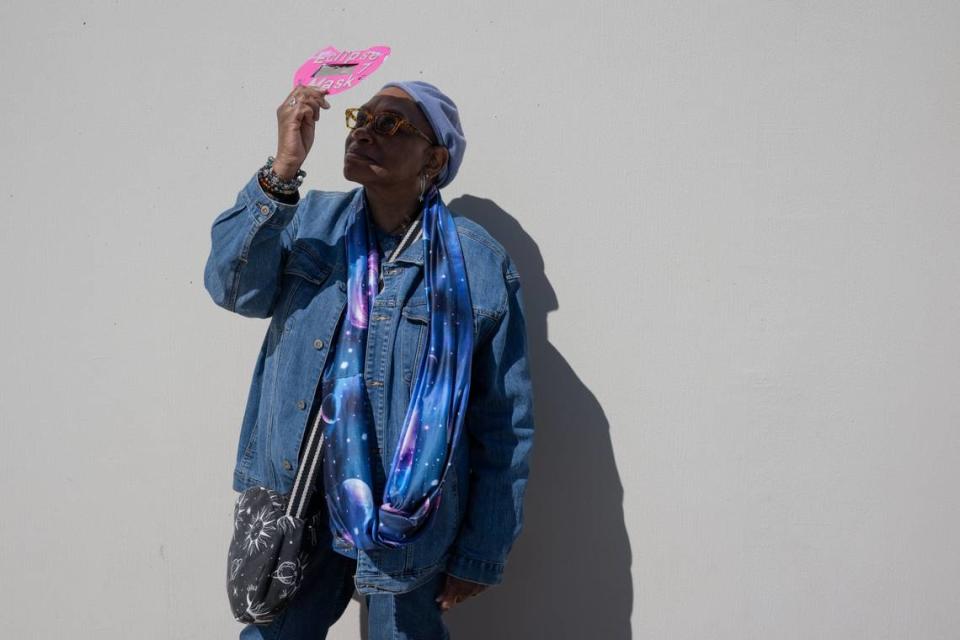 Beatrice Hagg of West Sacramento looks at the solar eclipse at the Museum of Science and Curiosity in Sacramento on Monday, April 8, 2024, with a viewer she made for the 2017 eclipse. She is wearing science-inspired clothing and said she has been interested in astronomy since she was a child. Paul Kitagaki Jr./pkitagaki@sacbee.com