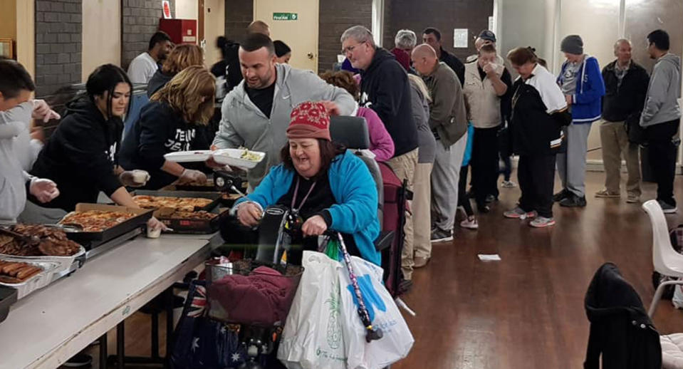 Daniel Abdallah is pictured with a number of kids volunteering with Team Jesus and feeding homeless people in Blacktown.