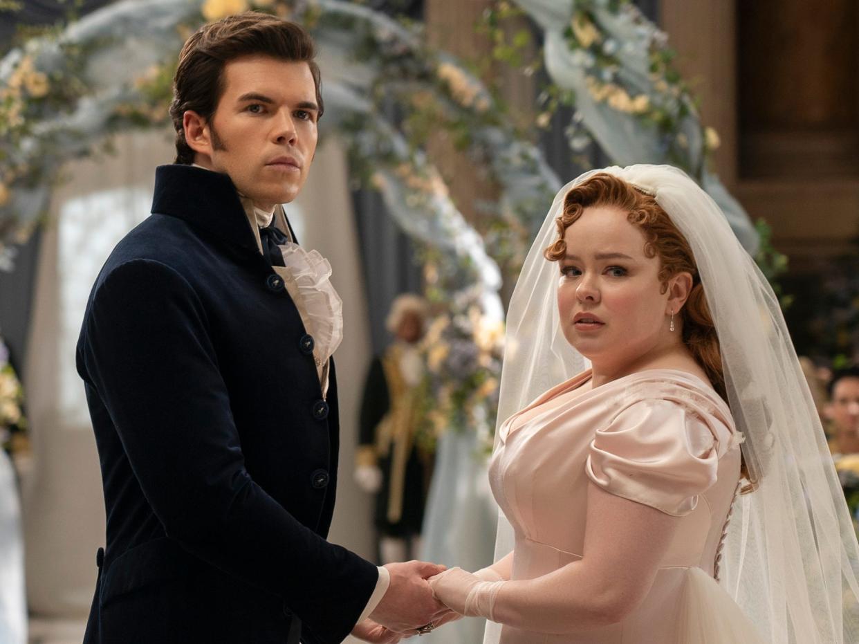 Colin (Luke Newton) and Penelope (Nicola Coughlan) at their wedding in "Bridgerton" season three.