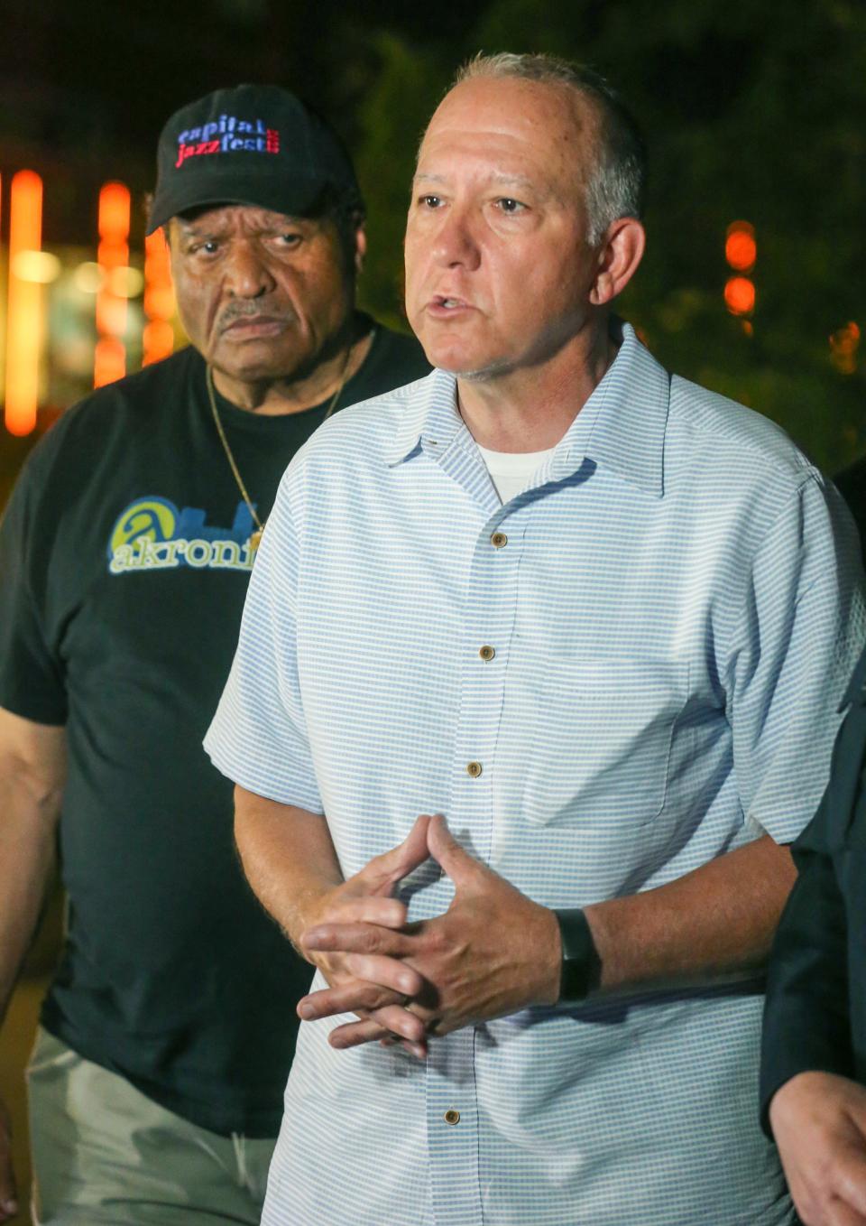 "Let’s stand down a little bit and start to listen to each other," Mayor Dan Horrigan urged at a press conference Friday night outside Akron Children's Hospital. At left is Marco Sommerville, deputy mayor for intergovernmental affairs.