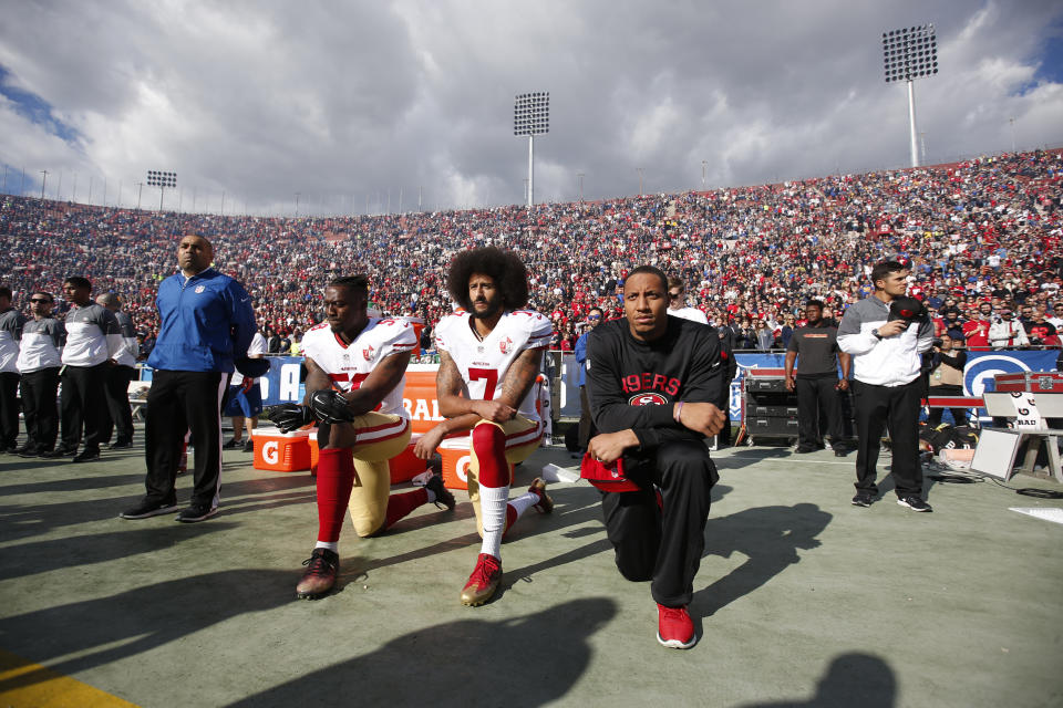 Eli Harold #58, Colin Kaepernick #7 and Eric Reid #35 of the San Francisco 49ers kneel on the sideline, during the anthem, prior to the game against the Los Angeles Rams at the Los Angeles Coliseum on December 24, 2016 in Los Angeles, California.&nbsp; (Photo: Michael Zagaris via Getty Images)