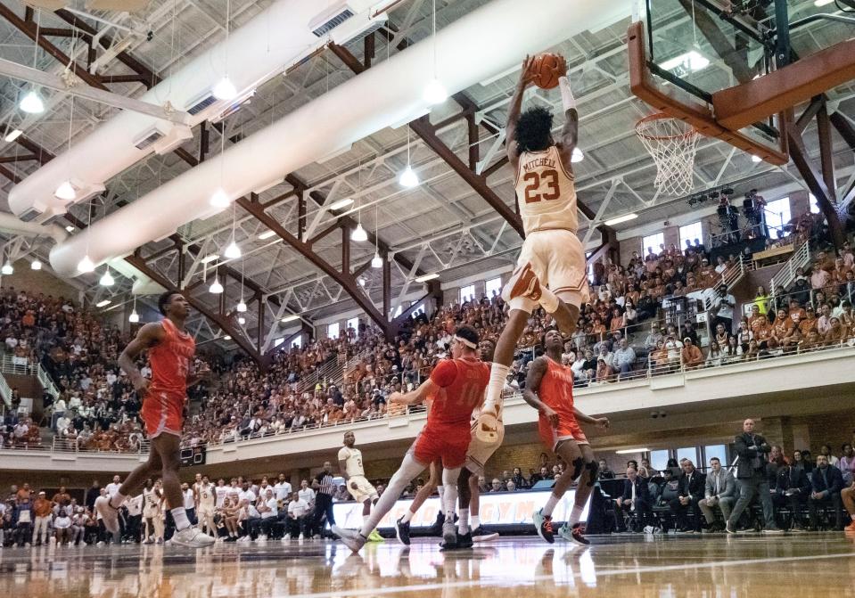 Texas guard Dillon Mitchell goes up for a dunk against UT Rio Grande Valley forward Dima Zdor during the Longhorns' win Saturday.
