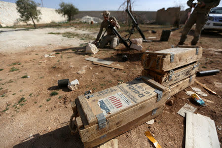 Rebel fighters prepare mortar shells before firing towards Syrian army soldiers, west of Manbij city, in Aleppo Governorate, Syria March 9, 2017. REUTERS/Khalil Ashawi