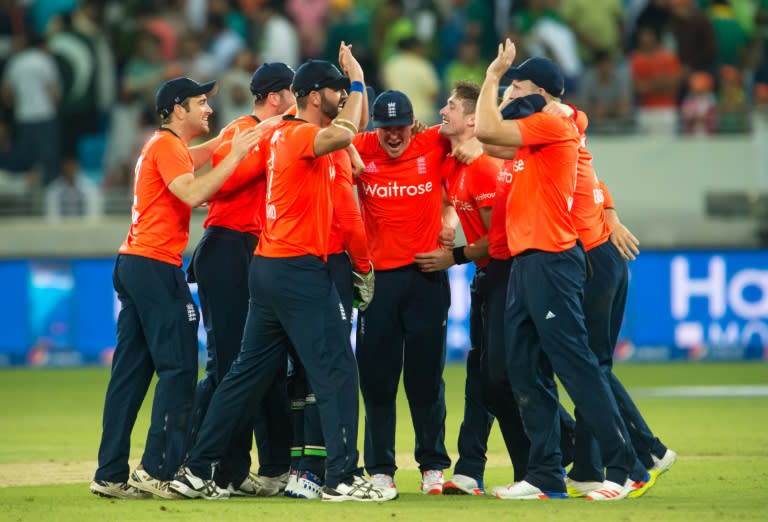 England's team members celebrate their victory during the second T20 cricket match between Pakistan and England at the Dubai International Cricket Stadium in Dubai on November 27, 2015