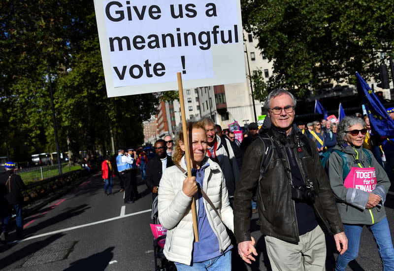 EU supporters, calling on the government to give Britons a vote on the final Brexit deal, attend a 'People's Vote' march in London